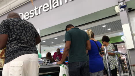People-queuing-to-a-cashier-in-a-supermarket