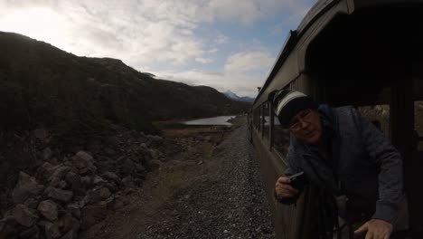 Skagway,-Alaska,-United-States---September-24,-2019:-Photographers-are-taking-pictures-on-the-Old-Historic-Railroad-Train-on-the-way-to-White-Pass