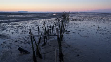 Carrasqueira-Palafitic-Pier-in-Comporta,-Portugal-at-sunset