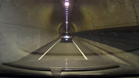 Driving-through-Baker-Barry-Tunnel-in-Northern-California,-San-Francisco-Marin-Highlands,-Single-Lane-Tunnel-on-a-foggy,-cloudy-summer-day