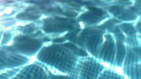 Ripples-on-the-surface-of-the-transparent-blue-water-in-a-pool