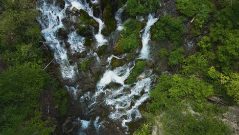 Rotating-aerial-dolly-shot-of-the-lower-Roughlock-Falls-in-Spearfish,-South-Dakota