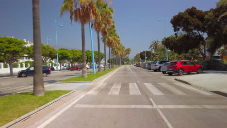 driving-through-boulevard-of-san-pedro-de-alcantara,-marbella,-malaga,-spain-holiday-destination