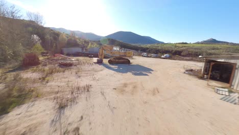 Flying-through-an-excavator-in-an-abandoned-quarry-with-an-FPV-drone