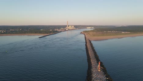 aerial-view-of-ocean-pier-alongside-canal-with-factory-and-bridge