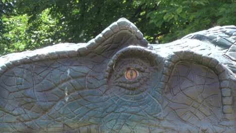 Realistic-Allosaurus-dinosaur-in-park-Head-and-eye