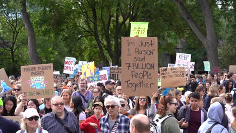 People-holding-up-signs-at-Global-climate-change-march