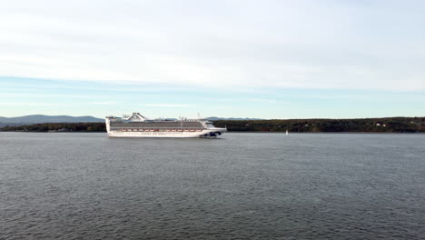 Drone---View-of-the-Caribbean-Princess-cruise-ship-over-the-Saint-Lawrence-River,-from-the-south-shore-of-Quebec-city