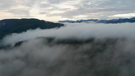Aerial-View-of-Foggy-Mountains-Moving-Sideways