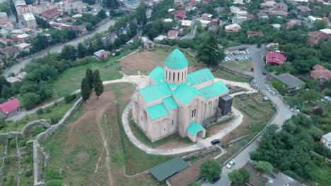 Circular-aerial-drone-shot-around-Bagrati-Cathedral-in-Kutaisi,-Georgia