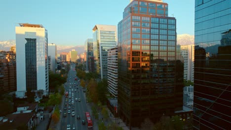 Aerial-establishing-shot-of-Mirrored-facade-Skyscrapers-in-the-Apoquindo-Avenue,-Santiago