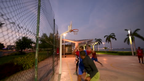 Luanda-Bay-Twilight,-street-basketball-,-Luanda-capital-of-Angola,-Africa