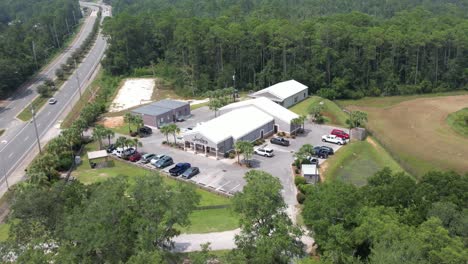 Aerial-View-Of-Small-Church-Building-With-Cars-Parked-Outside-In-Pensacola,-Florida