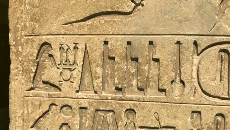 Hieroglyphic-detail-on-an-ancient-egyptian-tomb-wall-