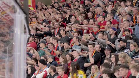 Ice-hockey-fans-cheering-for-their-team-in-a-crowded-stadium