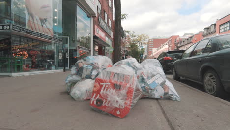 Editorial,-4k-Garbage,-recycle-trash-in-street,-on-sidewalk