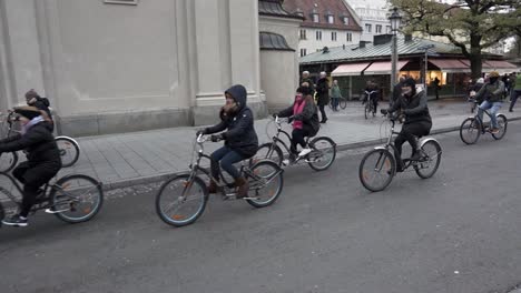 Cyclists-ride-through-the-middle-of-the-street-in-Munich-city-Germany
