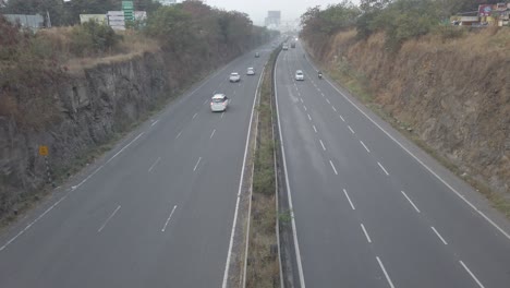 Multi-lane-Mumbai-Bangalore-highway-traffic-near-Pune,-road-travel-in-India