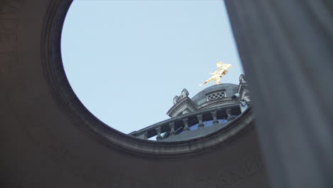 Revealing-shot-behind-a-pillar-of-the-ariel-tivoli-corner-of-the-Bank-of-England-in-slow-motion