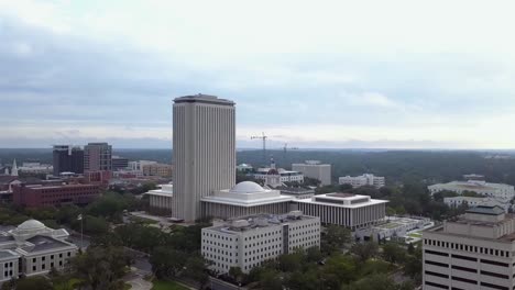 Slow-aerial-toward-and-around-New-Capitol-to-reveal-Old-Capitol-in-downtown-Tallahassee,-Florida