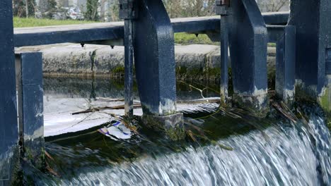 Flowing-water-through-the-old-sluice-gate-making-waterfall-,-Dublin-grand-canal-Ireland