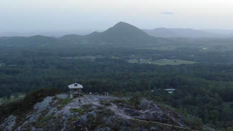 Tourists-at-Noosa-Heads-viewpoint-on-top-of-mount-Tinbeerwah-at-sunset,-Australia