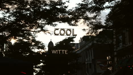 neon-art-sign-"cool"-hanging-across-the-street