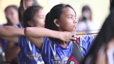 Training-of-asian-young-girls-during-a-shootout-session-of-archery