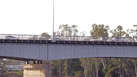 Cyclist-crossing-the-Fitzroy-River-bridge-with-cars-in-the-background
