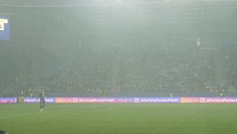 Fans-waving-their-hands-nad-lighting-phones-during-football-match