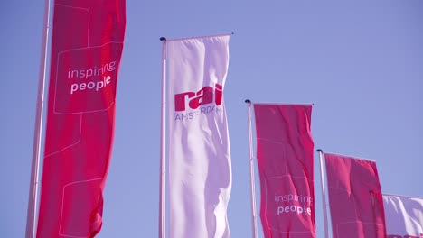 Rai-Amsterdam-Netherlands-flags-in-slow-motion-blue-sky