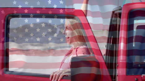 Animation-of-flag-of-usa-over-happy-caucasian-woman-by-car-on-beach