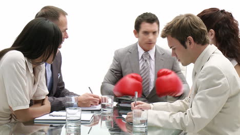 Stressed-manager-wearing-boxing-gloves-