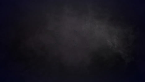 Animation-of-smoke-trails-and-colourful-shapes-on-black-background