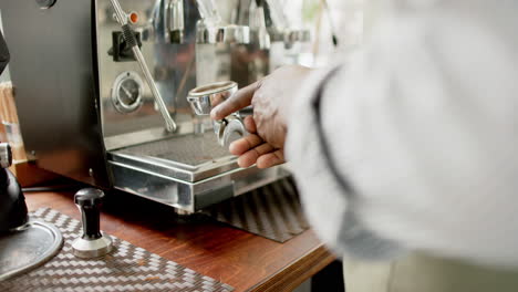 African-American-barista-operates-a-professional-espresso-machine