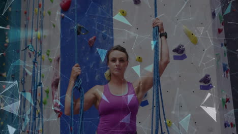 Animation-of-data-processing-over-caucasian-woman-climbing-wall