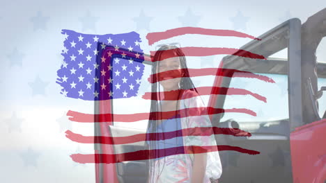 Animation-Der-US-Flagge-über-Einer-Glücklichen-Afroamerikanerin-Mit-Dem-Auto-Am-Strand