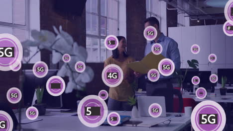 Animation-of-network-of-5g-text-and-icons-over-diverse-business-people-in-office