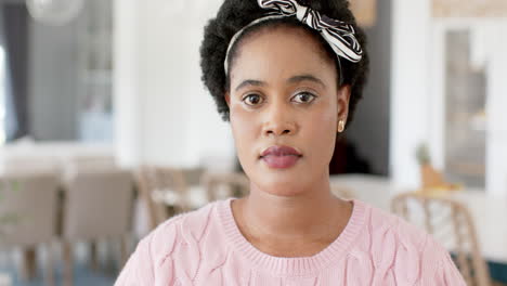 African-American-woman-with-a-thoughtful-expression-at-home