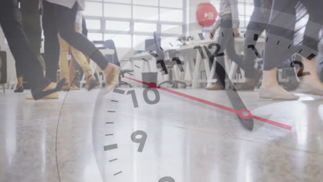 Animation-of-clock-moving-over-business-people-walking-in-office