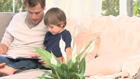 Adorable-boy-on-a-sofa-with-his-father-