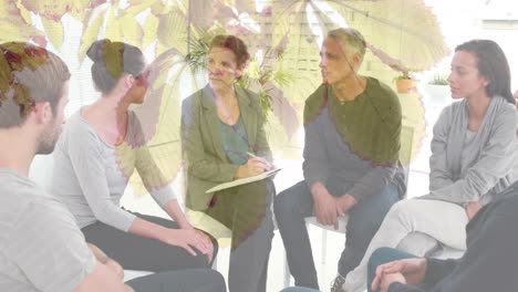 Animation-of-leaves-over-diverse-people-participating-in-group-therapy