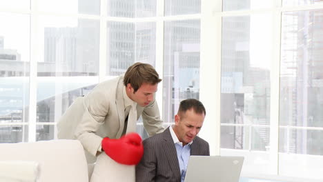 -Angry-businessman-punching-his-colleague