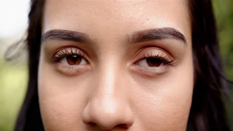 Close-up-reveals-a-young-biracial-woman-with-clear-skin-and-dark-brown-eyes