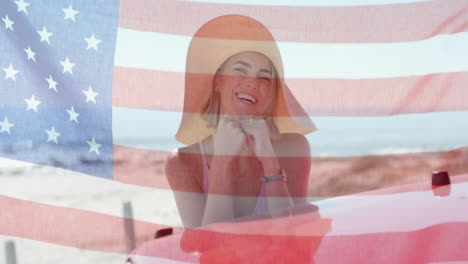 Animation-Der-Flagge-Der-USA-über-Einer-Kaukasischen-Frau-Mit-Dem-Auto-Am-Strand