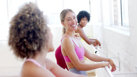 Three-women-are-enjoying-yoga-pilates-class-together