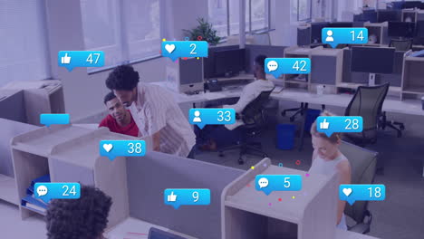 Animation-of-social-media-icons-with-numbers-over-diverse-colleagues-working-in-office