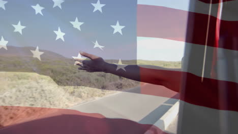 Animation-of-flag-of-usa-over-arm-of-african-american-woman-in-car-on-beach