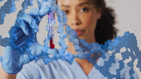 Animation-of-blue-dna-strand-over-biracial-female-doctor-holding-blood-sample