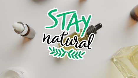 Animation-Des-Textes-„Stay-Natural“-Und-Des-Blattlogos-über-Bio-Schönheitscremes-Und--ölen-Auf-Weiß